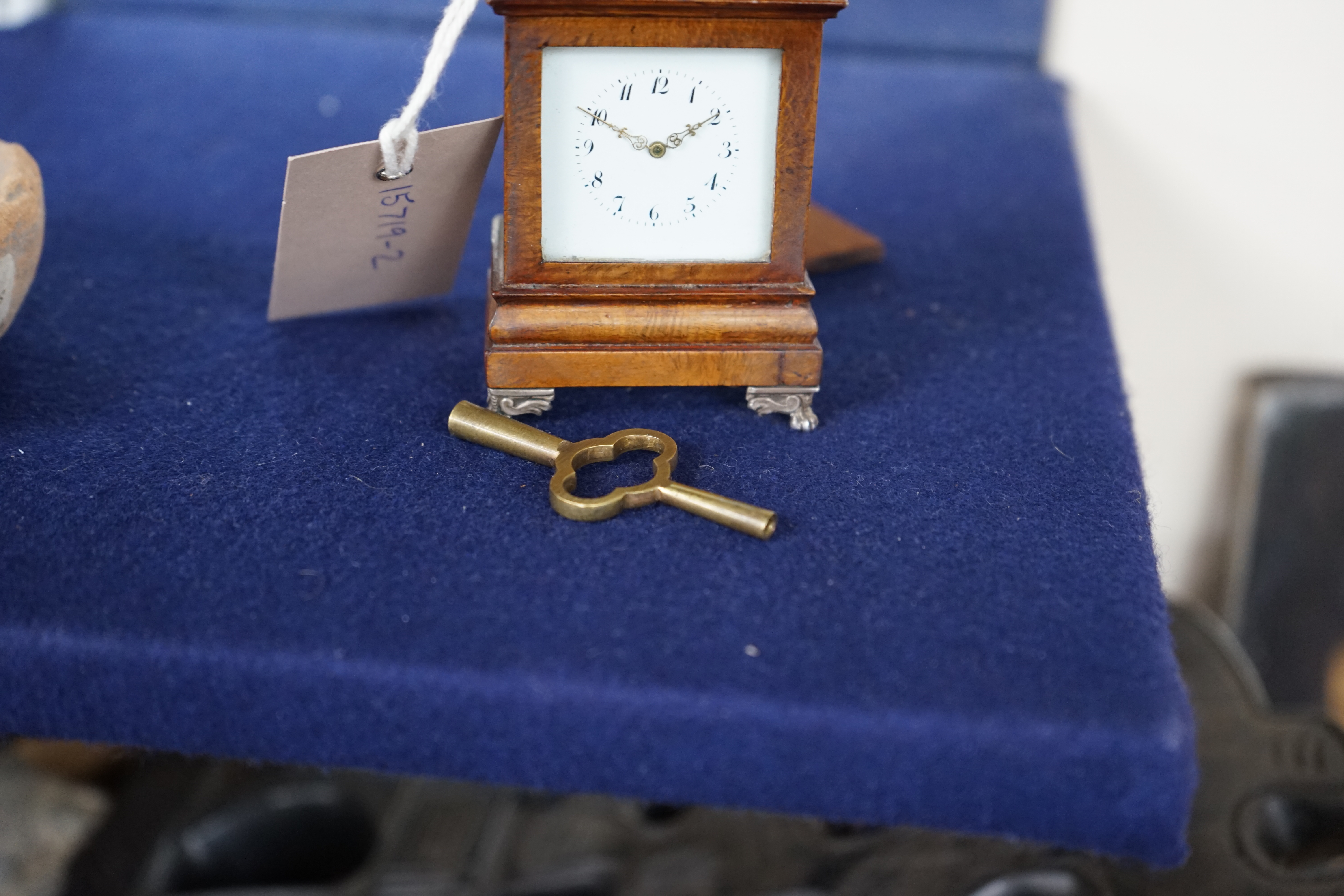 An early 20th century walnut miniature repeating carriage clock, with key, 8.5cm. Condition - fair, currently ticking